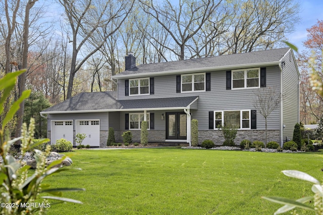 view of front of property with a garage, a front yard, stone siding, and a chimney