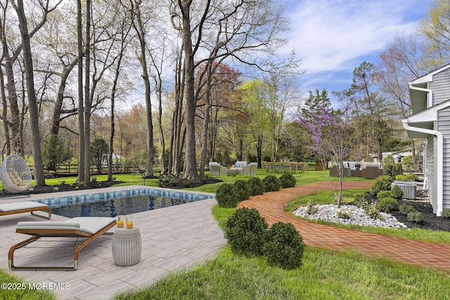 view of community featuring an outdoor hangout area, a patio, and a pool