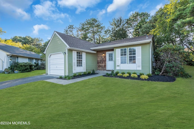 single story home featuring driveway, a shingled roof, a front lawn, and a garage