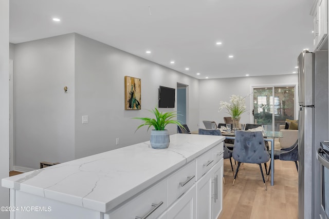 kitchen with white cabinetry, recessed lighting, and light wood-style flooring