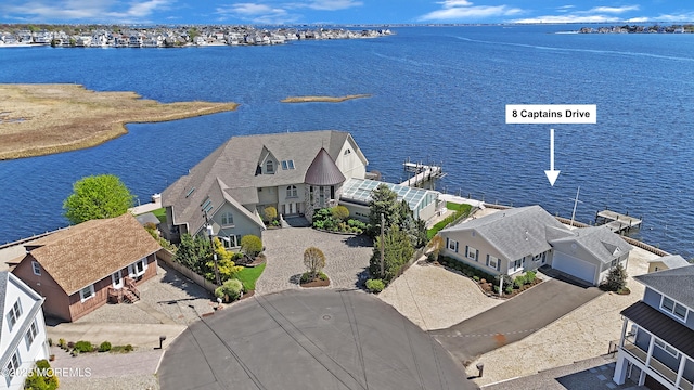 bird's eye view with a water view and a residential view