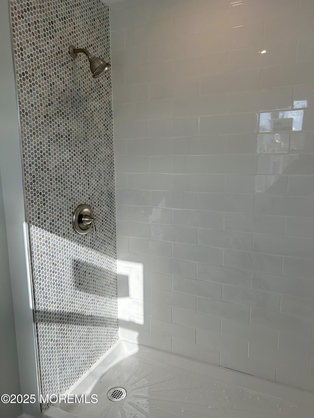 details with a tile shower
