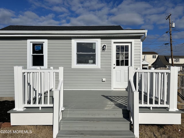 doorway to property featuring a wooden deck