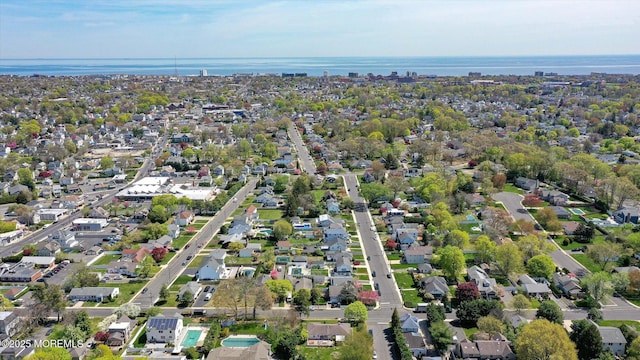 bird's eye view featuring a water view and a residential view