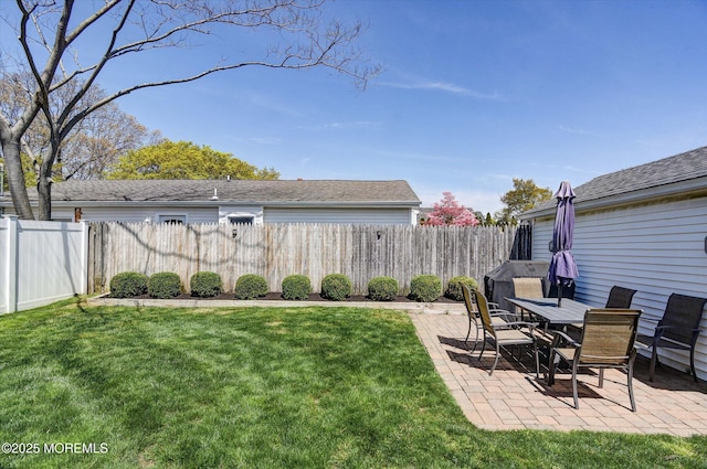 view of yard with a patio and a fenced backyard