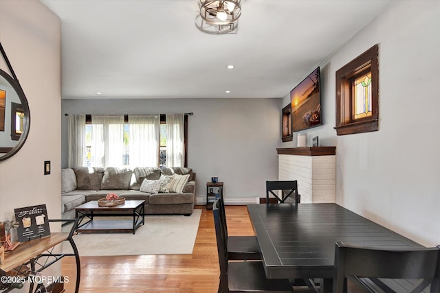 dining space featuring light wood-style floors and recessed lighting