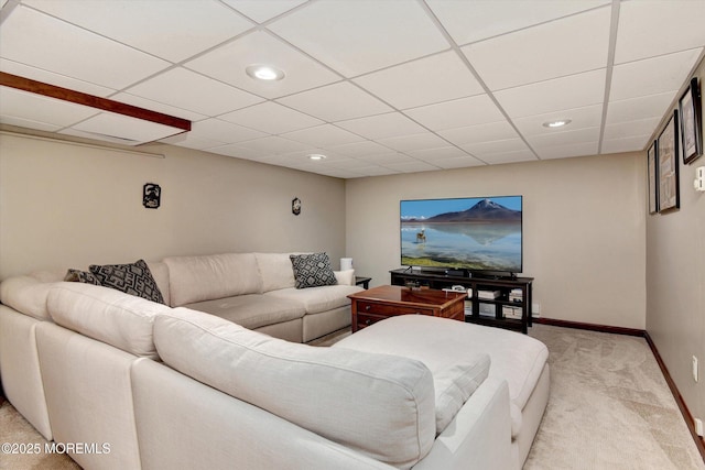 living area with a paneled ceiling, recessed lighting, baseboards, and light carpet
