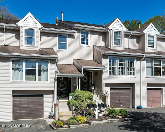 31 Mulberry Ct Unit B, Brielle, NJ 08730 - multi unit property with an attached garage, driveway, and roof with shingles