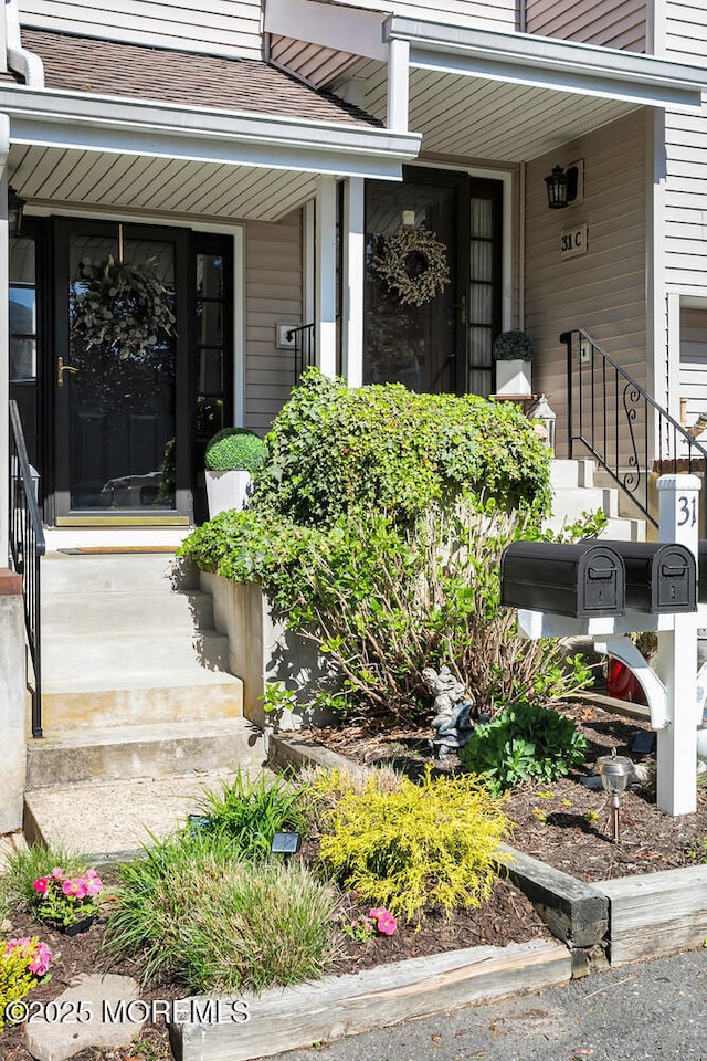 31 Mulberry Ct Unit B, Brielle, NJ 08730 - view of exterior entry featuring roof with shingles and covered porch