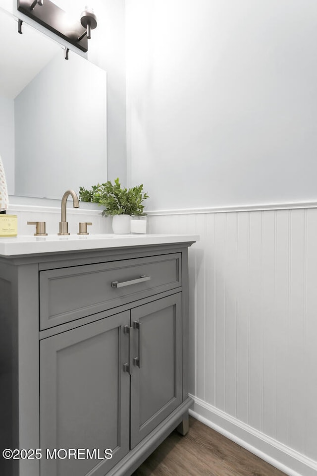 31 Mulberry Ct Unit B, Brielle, NJ 08730 - bathroom featuring vanity, baseboards, wainscoting, and wood finished floors
