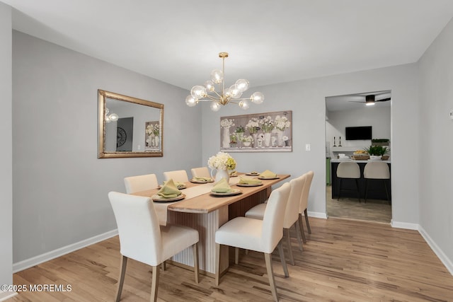 31 Mulberry Ct Unit B, Brielle, NJ 08730 - dining space with baseboards, an inviting chandelier, and light wood-style floors