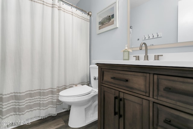 31 Mulberry Ct Unit B, Brielle, NJ 08730 - full bath with vanity, wood finished floors, toilet, and a shower with curtain