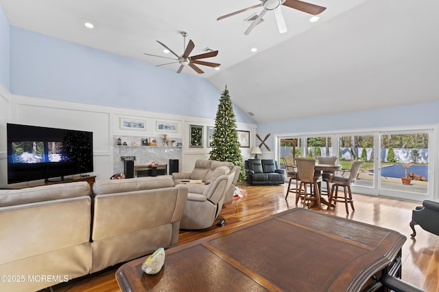 1582 Beaver Hollow Dr, Toms River, NJ 08755 - living room featuring ceiling fan, wood finished floors, high vaulted ceiling, and a premium fireplace