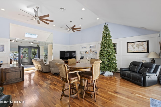 1582 Beaver Hollow Dr, Toms River, NJ 08755 - dining space featuring ceiling fan, hardwood / wood-style flooring, a skylight, high vaulted ceiling, and recessed lighting