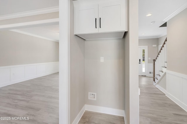 corridor featuring light wood-style floors, recessed lighting, crown molding, and stairway