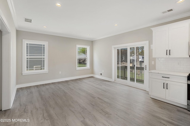 interior space with recessed lighting, baseboards, visible vents, and light wood-style flooring