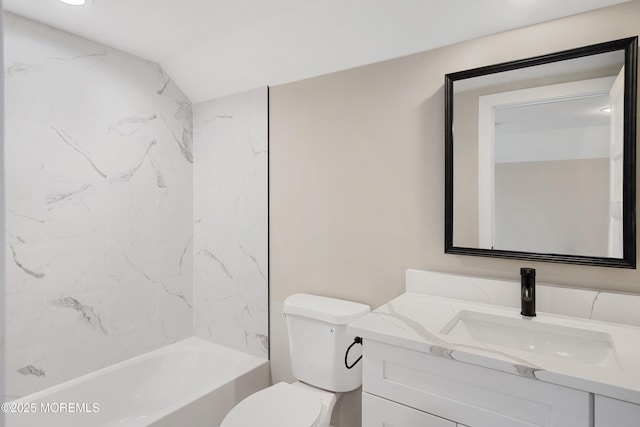 bathroom with vanity, shower / bath combination, and toilet