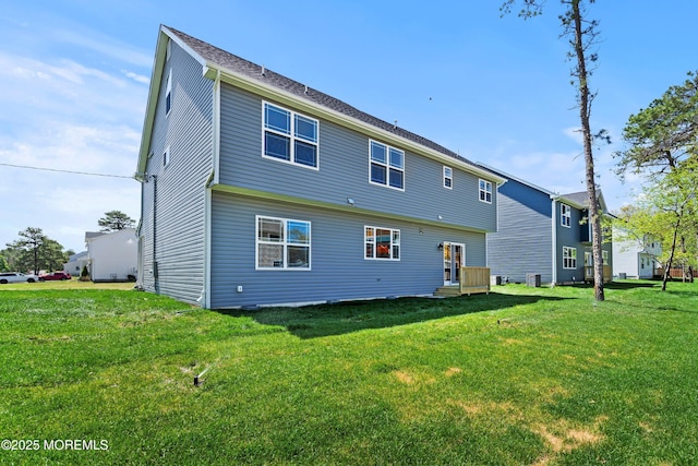 back of property with a yard