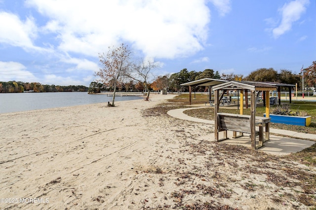 view of property's community with a gazebo and a water view