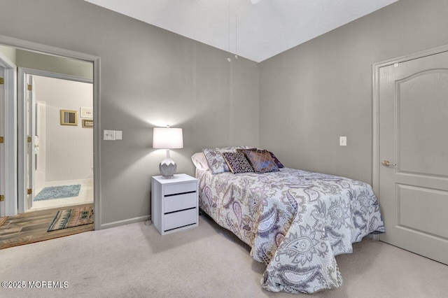 bedroom with carpet floors and baseboards