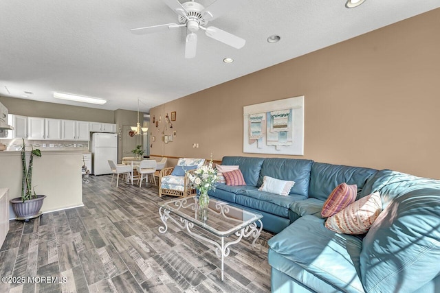 living area with recessed lighting, a textured ceiling, ceiling fan, and wood finished floors