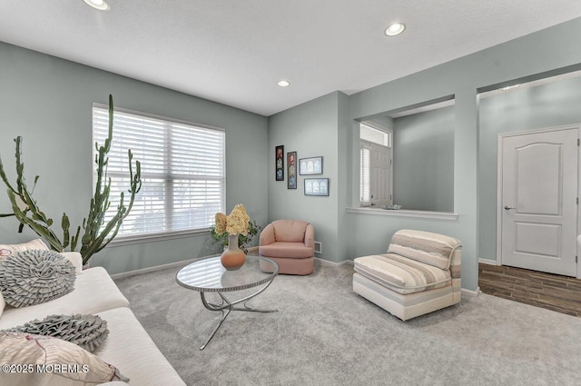 carpeted living room with baseboards and recessed lighting