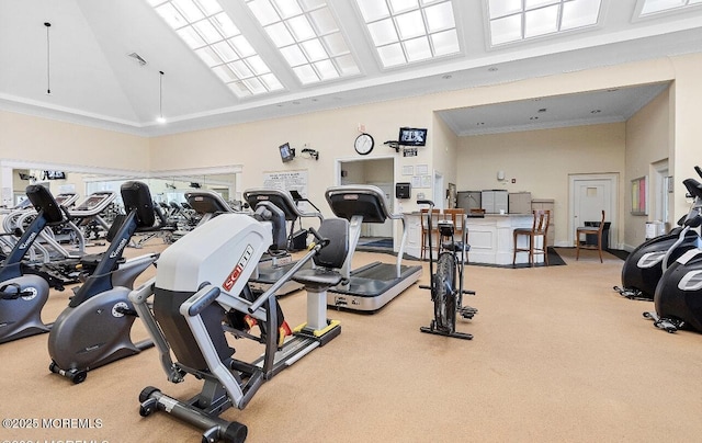 workout area featuring carpet floors, high vaulted ceiling, and ornamental molding