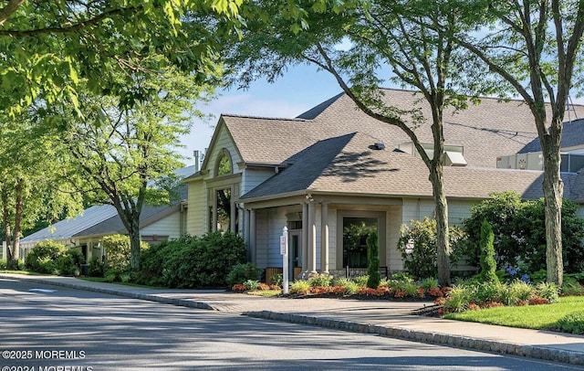 view of front of property with roof with shingles
