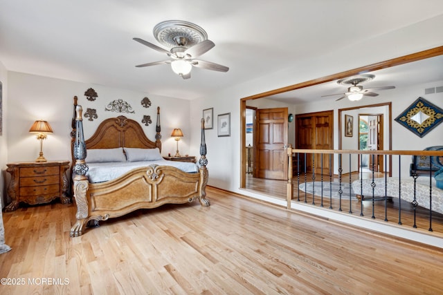 bedroom featuring light wood-style flooring and visible vents