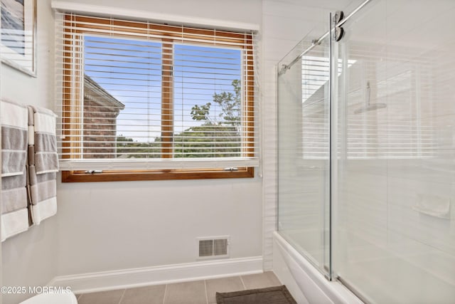 bathroom with baseboards, visible vents, and tile patterned flooring