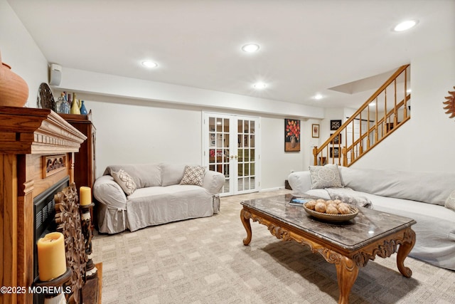 living room featuring recessed lighting, carpet floors, french doors, and stairs