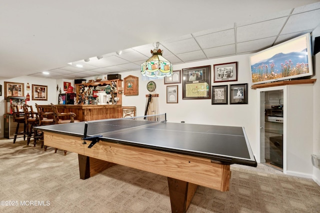 playroom featuring a dry bar, carpet, and a drop ceiling