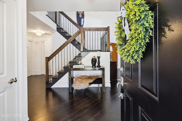 entrance foyer featuring wood finished floors and stairway