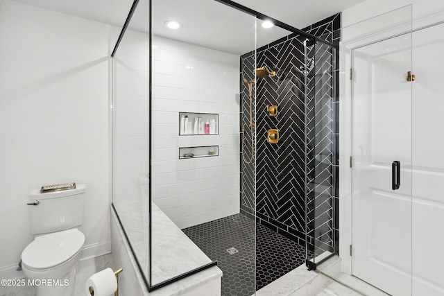 bathroom with recessed lighting, a shower stall, and toilet