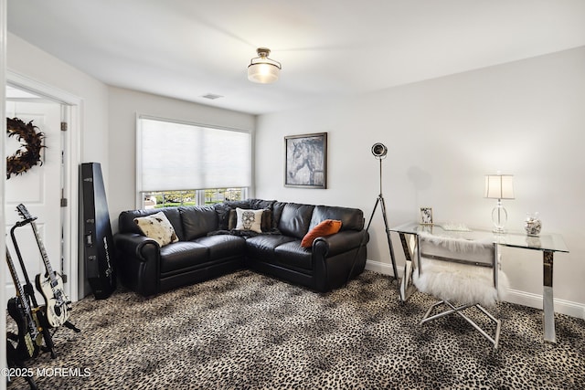 living room with carpet floors, baseboards, and visible vents