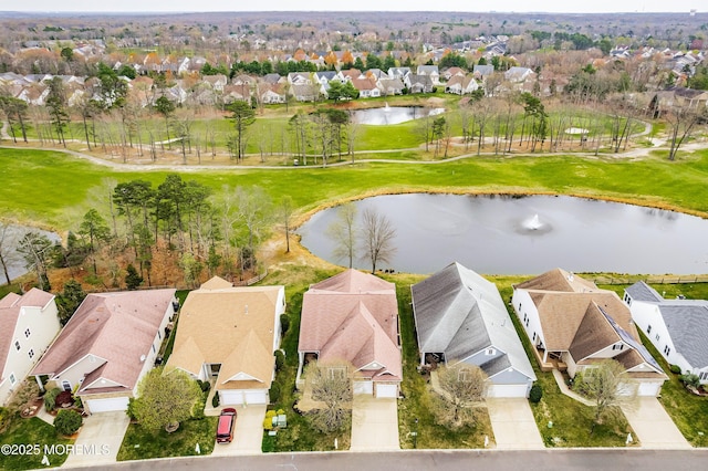birds eye view of property featuring a water view and a residential view