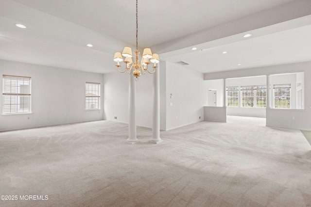 interior space featuring visible vents, baseboards, a notable chandelier, light carpet, and recessed lighting