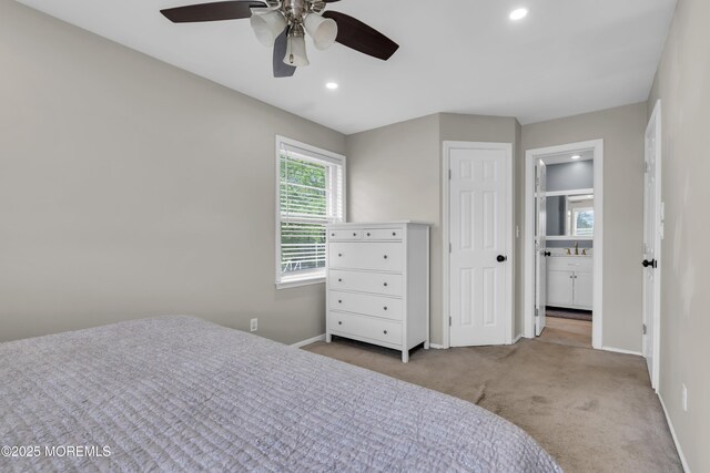 bedroom with carpet, connected bathroom, recessed lighting, and baseboards