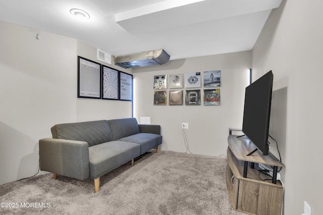 living area featuring visible vents and carpet floors