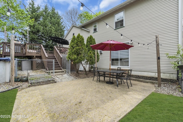 view of patio featuring a deck and stairs