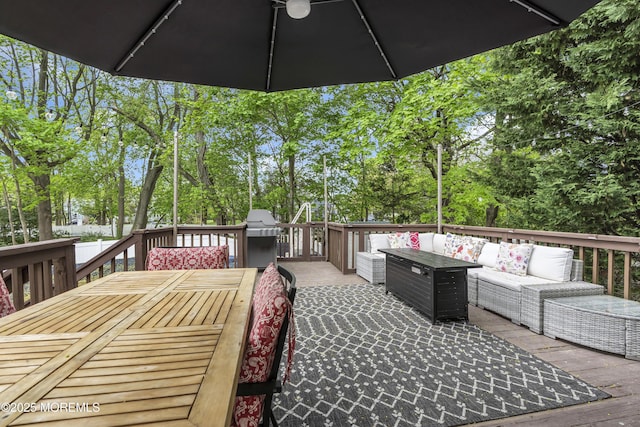 wooden terrace featuring outdoor lounge area and outdoor dining area