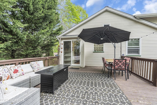 deck featuring outdoor lounge area and outdoor dining area
