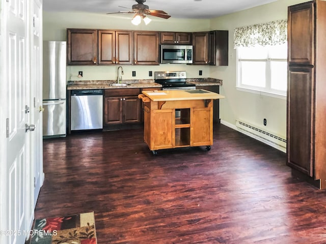 19 Florida Dr Unit A, Whiting, NJ 08759 - kitchen with appliances with stainless steel finishes, baseboard heating, light countertops, ceiling fan, and dark wood-style floors