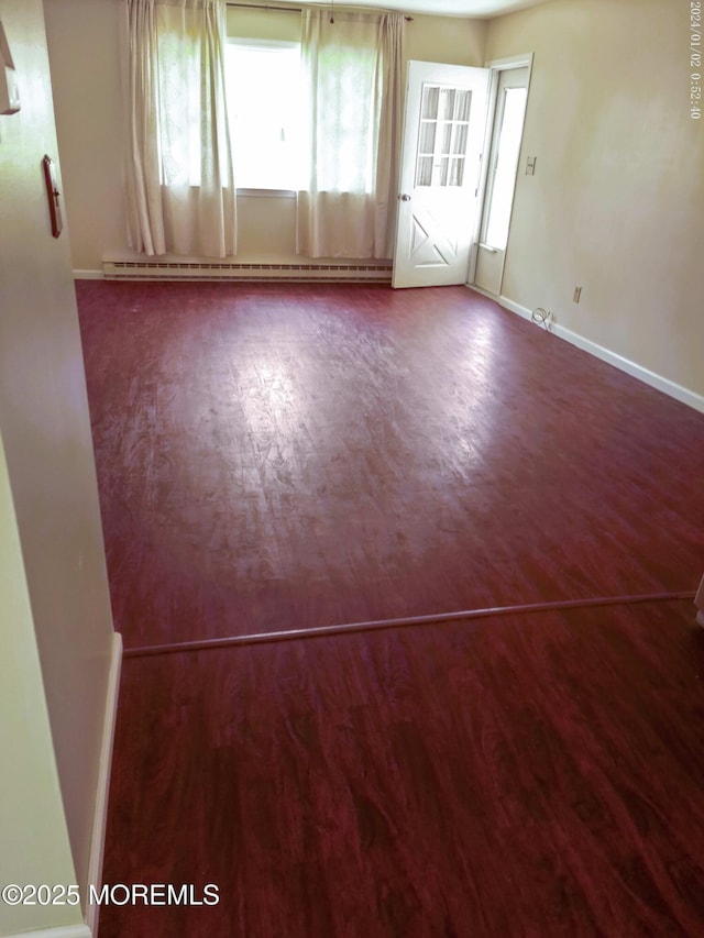 19 Florida Dr Unit A, Whiting, NJ 08759 - spare room featuring wood finished floors, baseboard heating, plenty of natural light, and baseboards