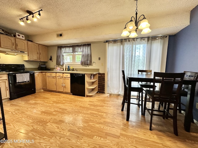 136 Windward Dr, Barnegat, NJ 08005 - kitchen with a textured ceiling, a chandelier, light wood-style flooring, under cabinet range hood, and black appliances