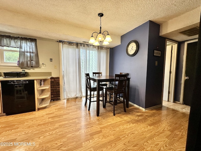 136 Windward Dr, Barnegat, NJ 08005 - dining area with light wood-style floors, a textured ceiling, a chandelier, and visible vents