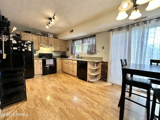 136 Windward Dr, Barnegat, NJ 08005 - kitchen featuring light brown cabinets, a textured ceiling, under cabinet range hood, visible vents, and black appliances
