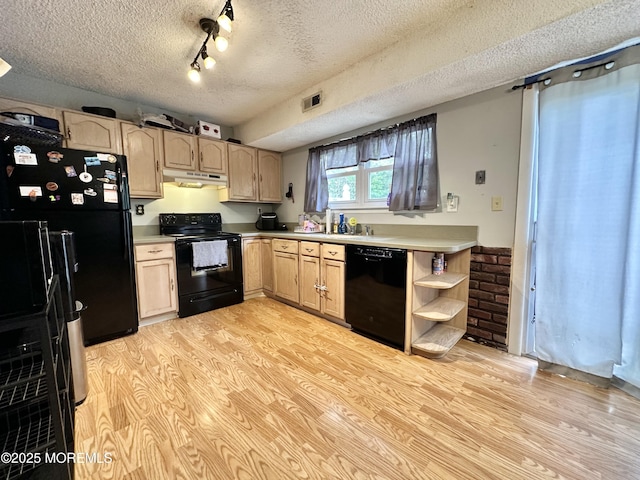 136 Windward Dr, Barnegat, NJ 08005 - kitchen featuring under cabinet range hood, a textured ceiling, black appliances, and light brown cabinets