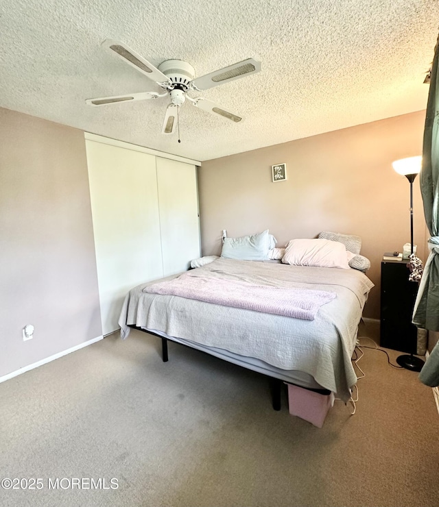 136 Windward Dr, Barnegat, NJ 08005 - bedroom featuring a closet, a ceiling fan, carpet flooring, and a textured ceiling