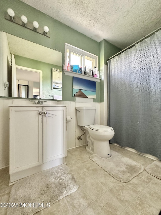 136 Windward Dr, Barnegat, NJ 08005 - full bath with toilet, a textured ceiling, wainscoting, and vanity